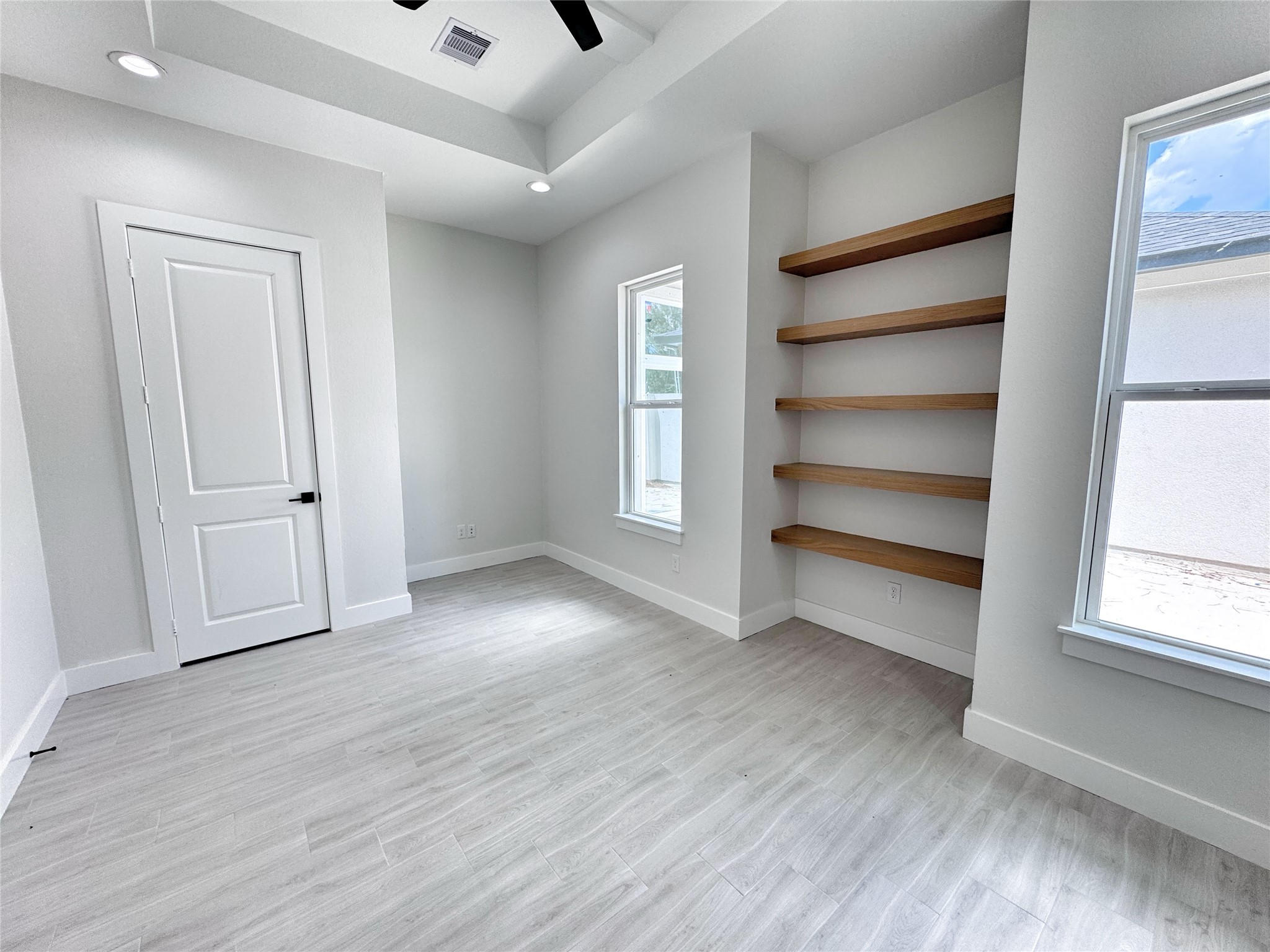 27710 Colapis Drive Splendora, TX 77372 - Photo 35 of 49 a view of an empty room with a window and wooden floor