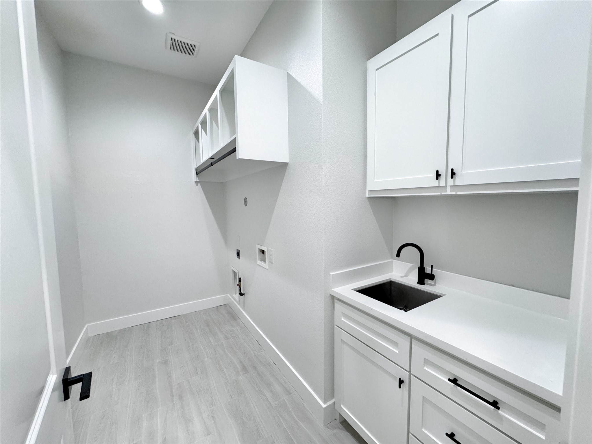 27710 Colapis Drive Splendora, TX 77372 - Photo 38 of 49 a kitchen with a sink and cabinets