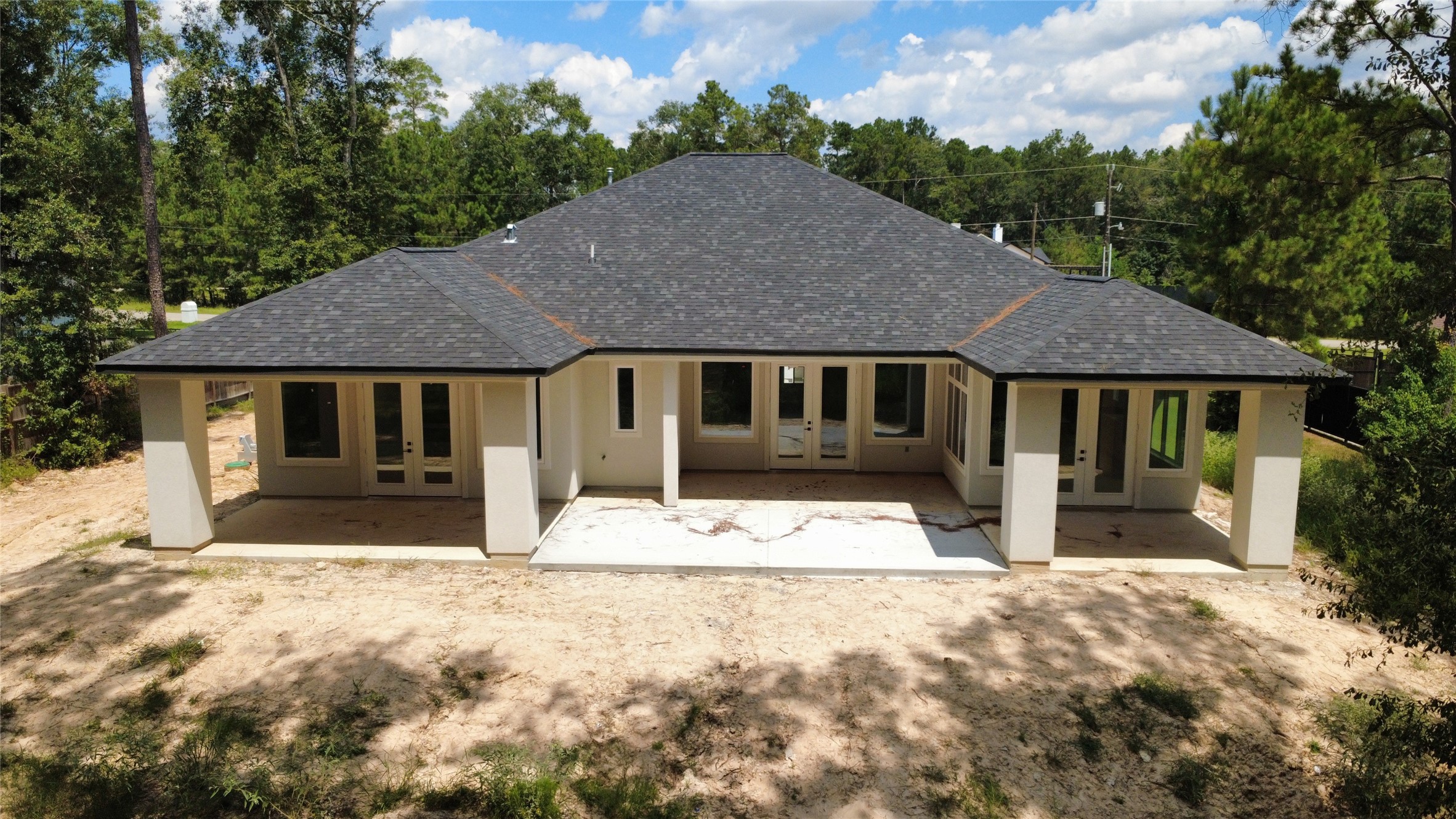27710 Colapis Drive Splendora, TX 77372 - Photo 47 of 49 a front view of a house with a yard covered in snow