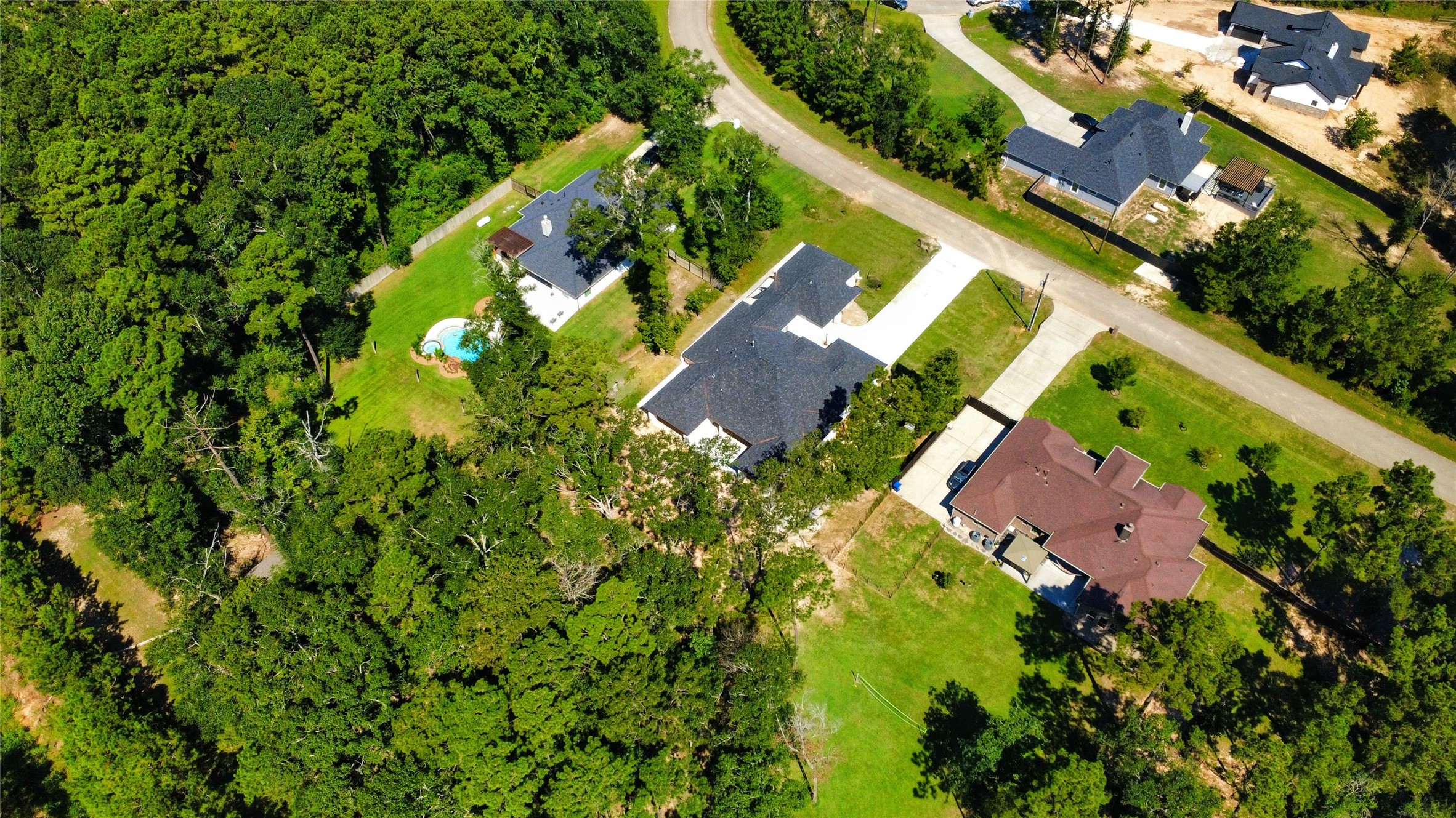 27710 Colapis Drive Splendora, TX 77372 - Photo 49 of 49 an aerial view of a house with a yard