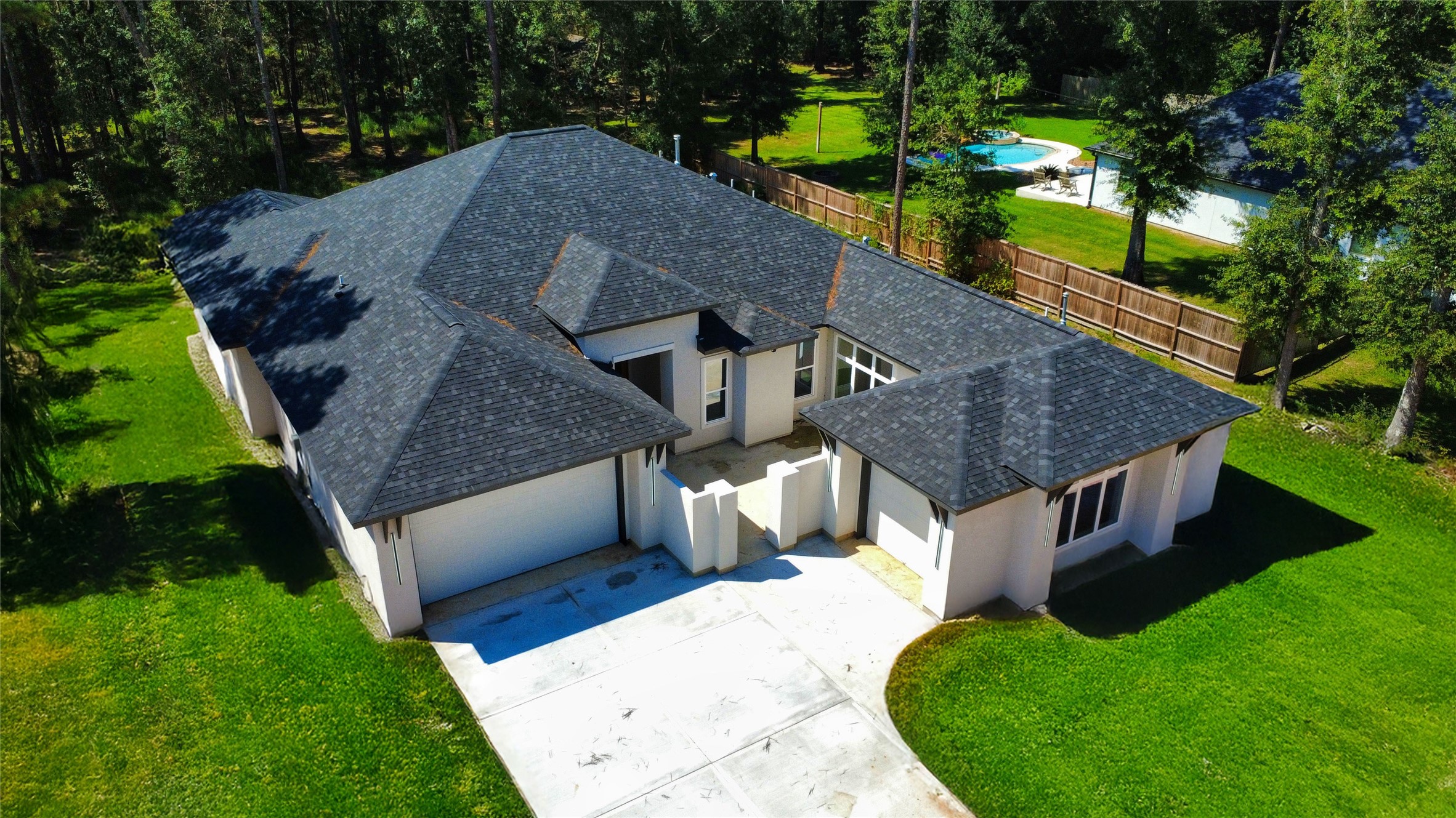 27710 Colapis Drive Splendora, TX 77372 - Photo 5 of 49 a aerial view of a house with a yard and large trees