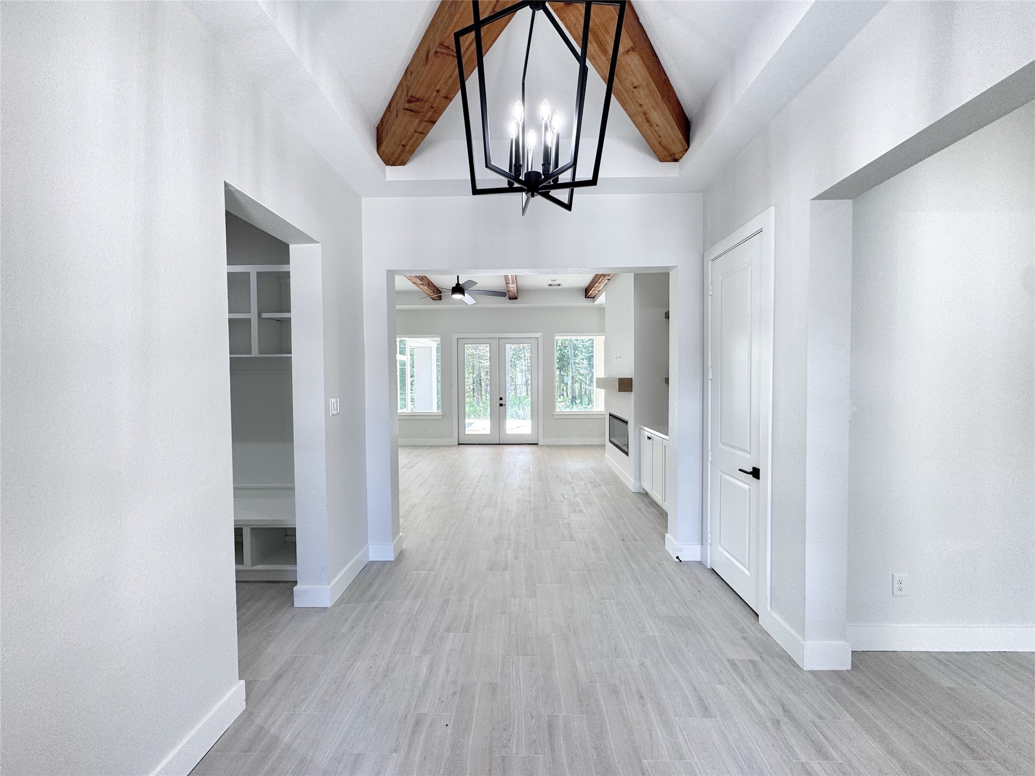 27710 Colapis Drive Splendora, TX 77372 - Photo 6 of 49 a view of hallway with chandelier and wooden floor