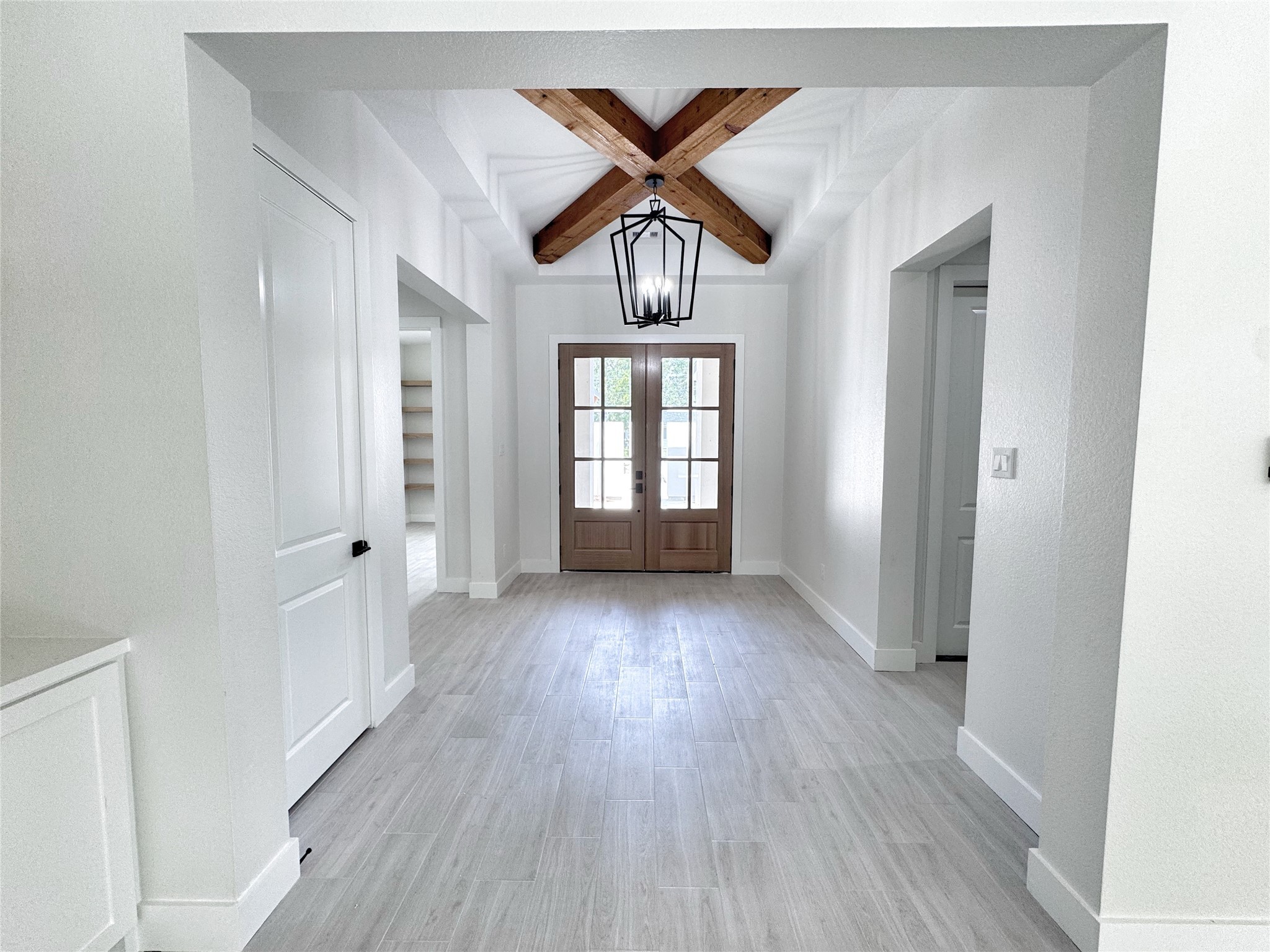 27710 Colapis Drive Splendora, TX 77372 - Photo 7 of 49 a view of an empty room with window and wooden floor