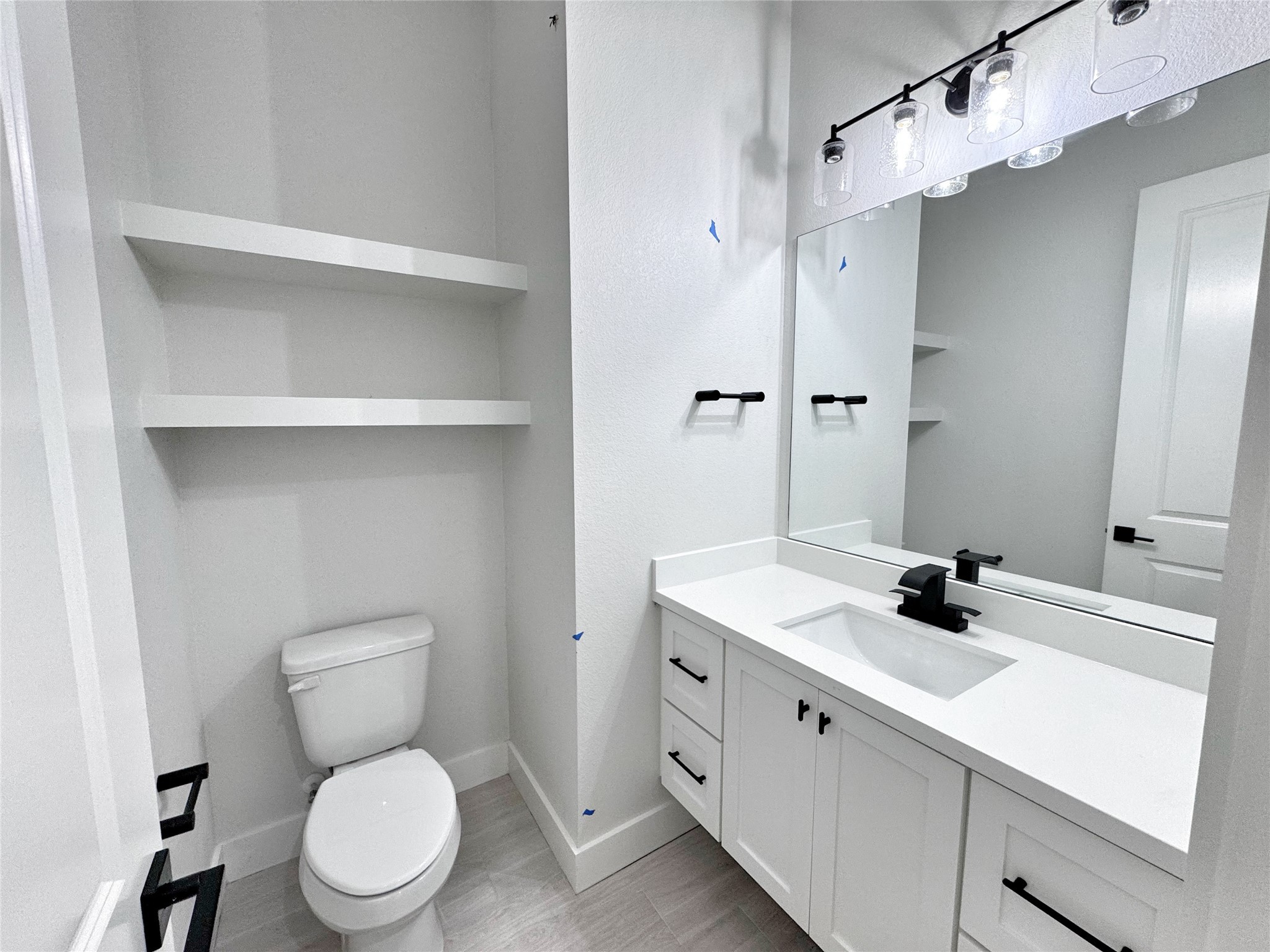 27710 Colapis Drive Splendora, TX 77372 - Photo 9 of 49 a bathroom with a sink toilet vanity and shower