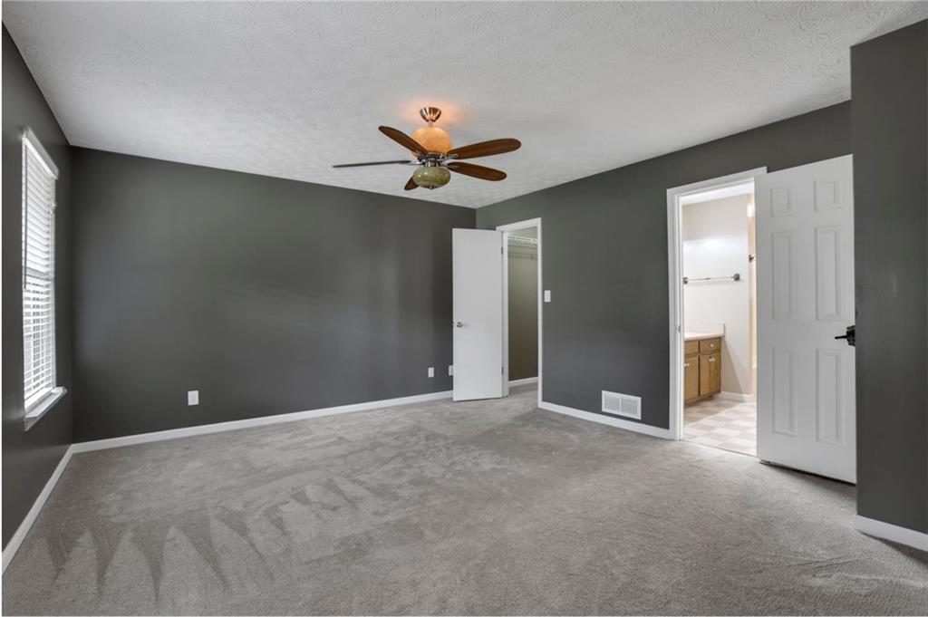 4378 Ridge Court Loganville, GA 30052 - Photo 15 of 47 a view of an empty room with a window