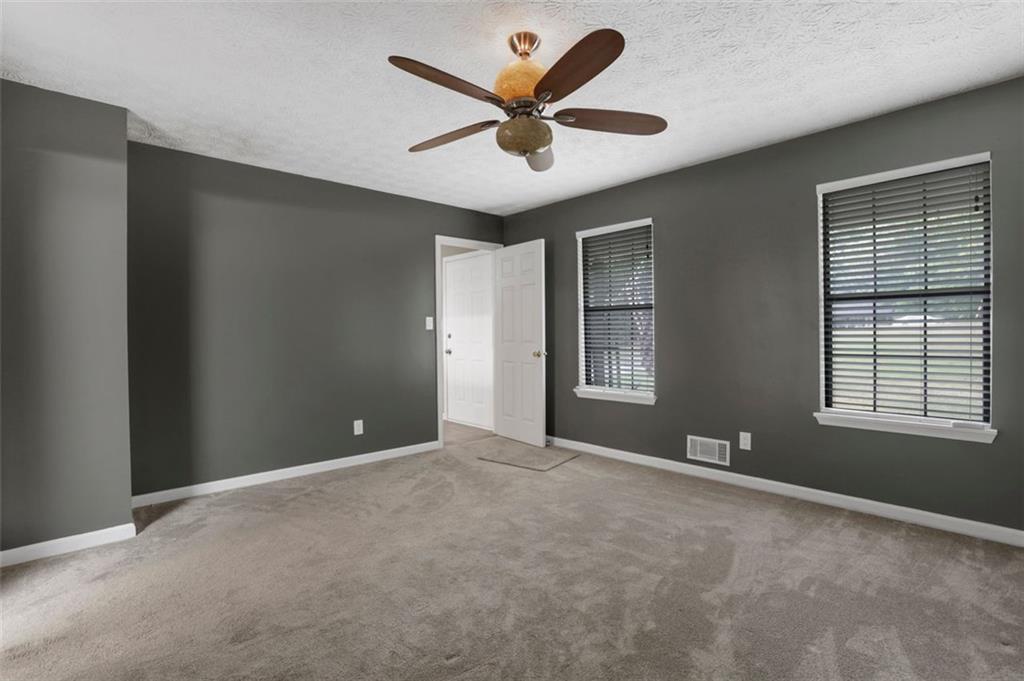 4378 Ridge Court Loganville, GA 30052 - Photo 17 of 47 a view of an empty room with a window