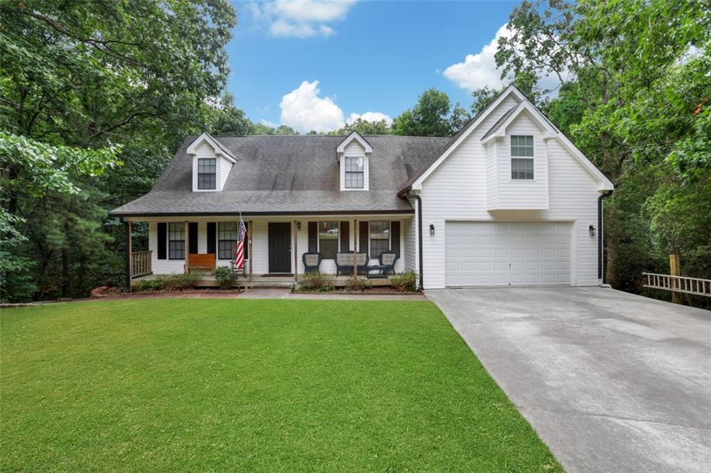 4378 Ridge Court Loganville, GA 30052 - Photo 2 of 47 a front view of house with yard and outdoor seating