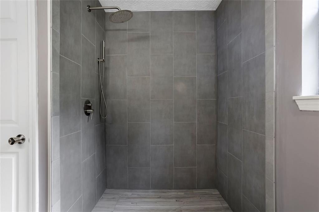 4378 Ridge Court Loganville, GA 30052 - Photo 26 of 47 a bathroom with a shower