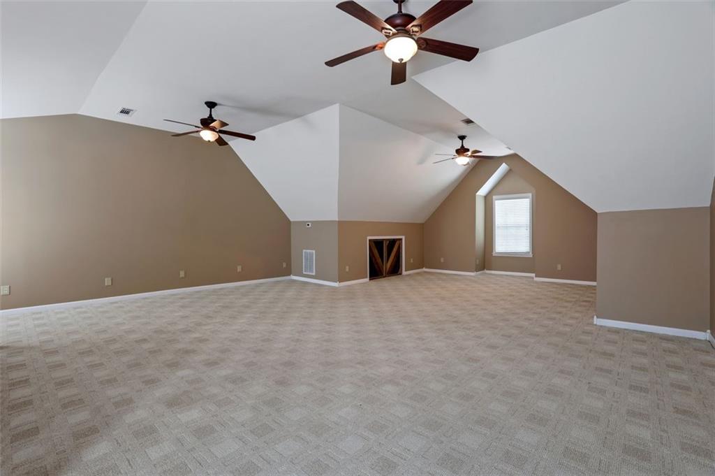 4378 Ridge Court Loganville, GA 30052 - Photo 30 of 47 a view of a livingroom with a ceiling fan and window