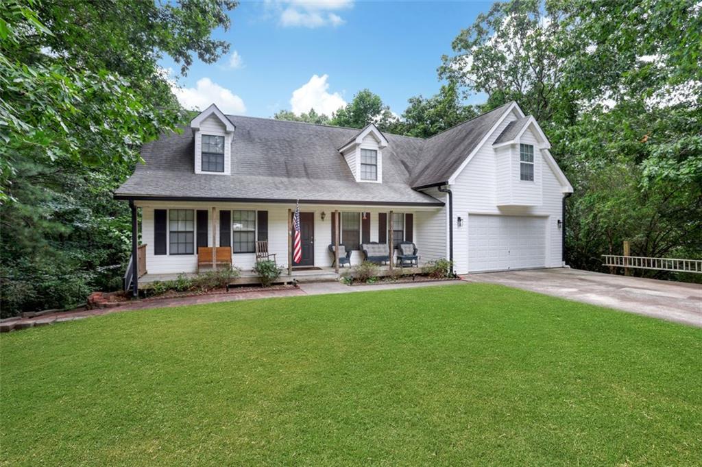 4378 Ridge Court Loganville, GA 30052 - Photo 3 of 47 a front view of a house with yard and green space