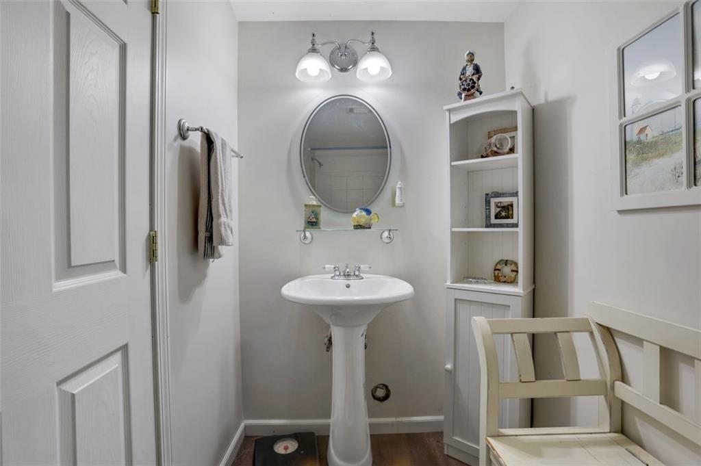 4378 Ridge Court Loganville, GA 30052 - Photo 36 of 47 a bathroom with a sink and a mirror