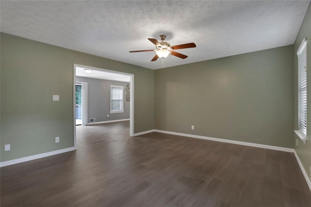 4378 Ridge Court Loganville, GA 30052 - Photo 4 of 47 an empty room with closet and a ceiling fan