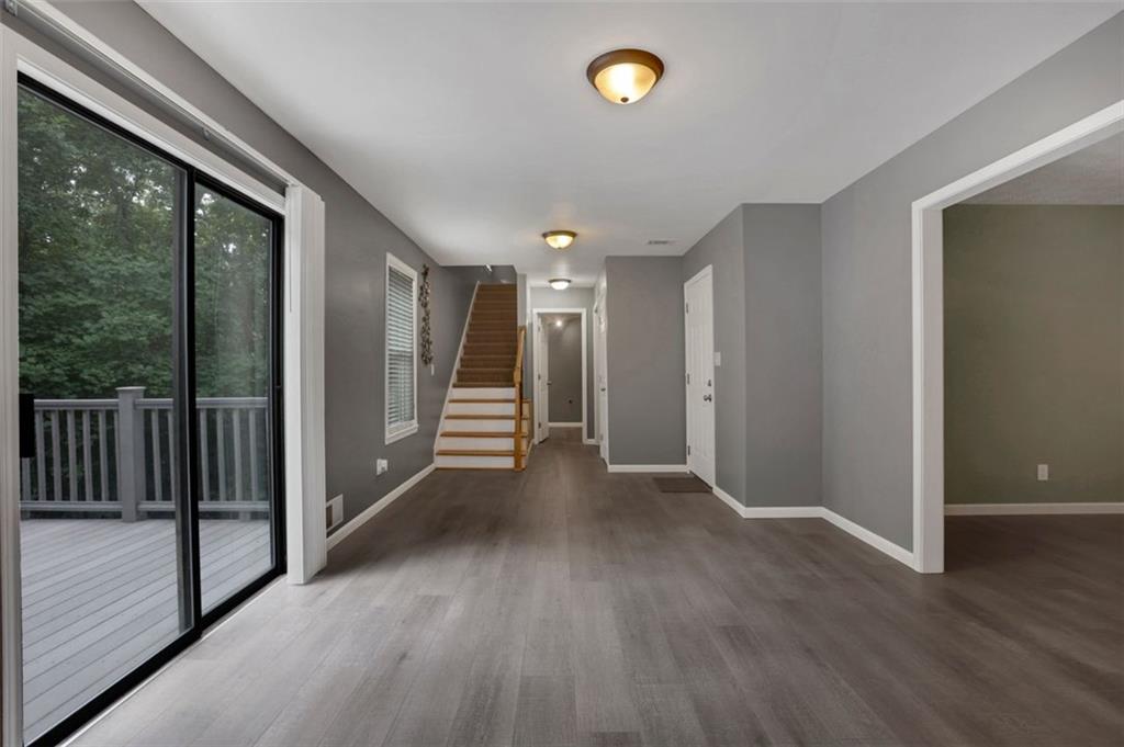 4378 Ridge Court Loganville, GA 30052 - Photo 8 of 47 a view of a hallway with wooden floor
