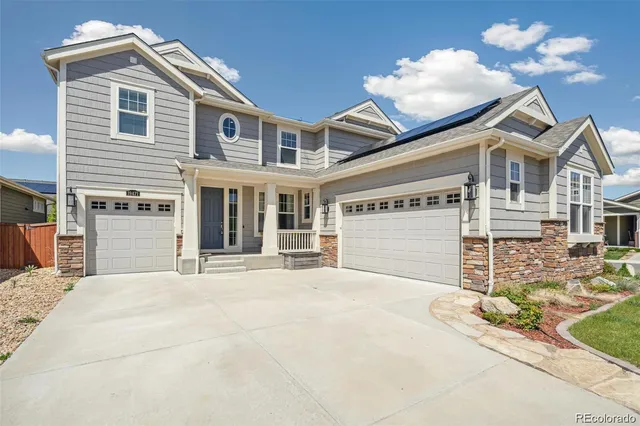 a front view of a house with a garage