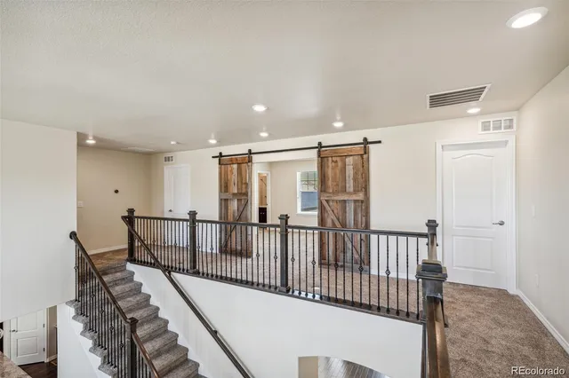 a view of a hallway with windows