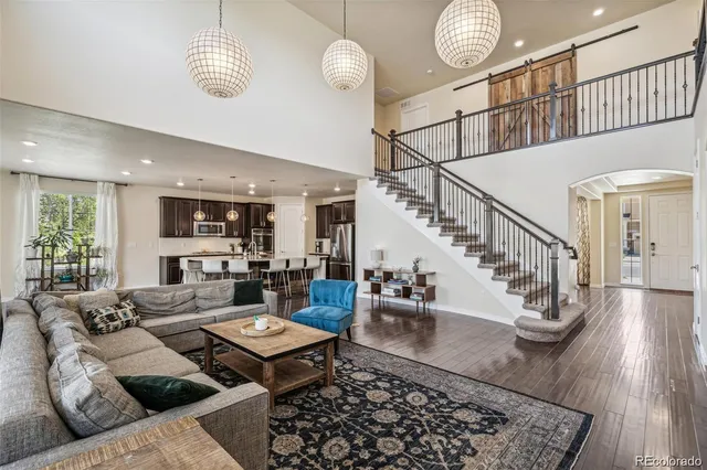 a living room with furniture and a rug