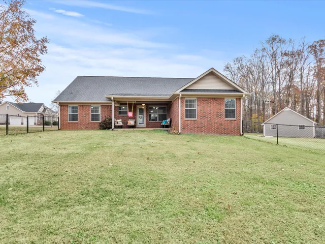 a view of a backyard with barn