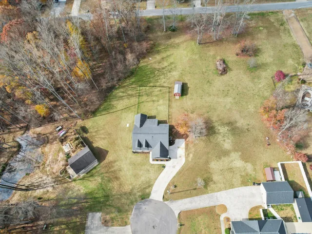 a view of a swimming pool with a yard