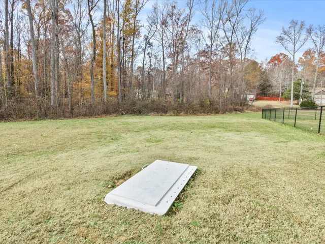 a view of a living room and kitchen with furniture