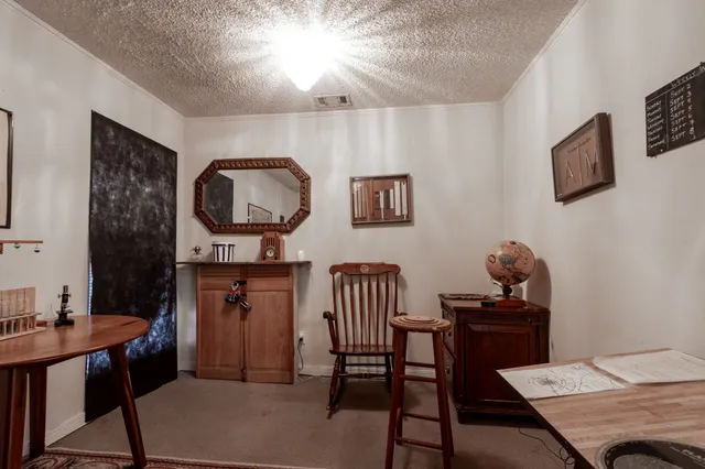 a view of a workspace with furniture