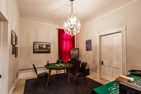 a bedroom with furniture and a window