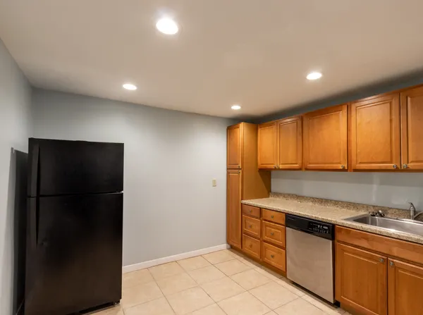 a kitchen that has a sink and a stove