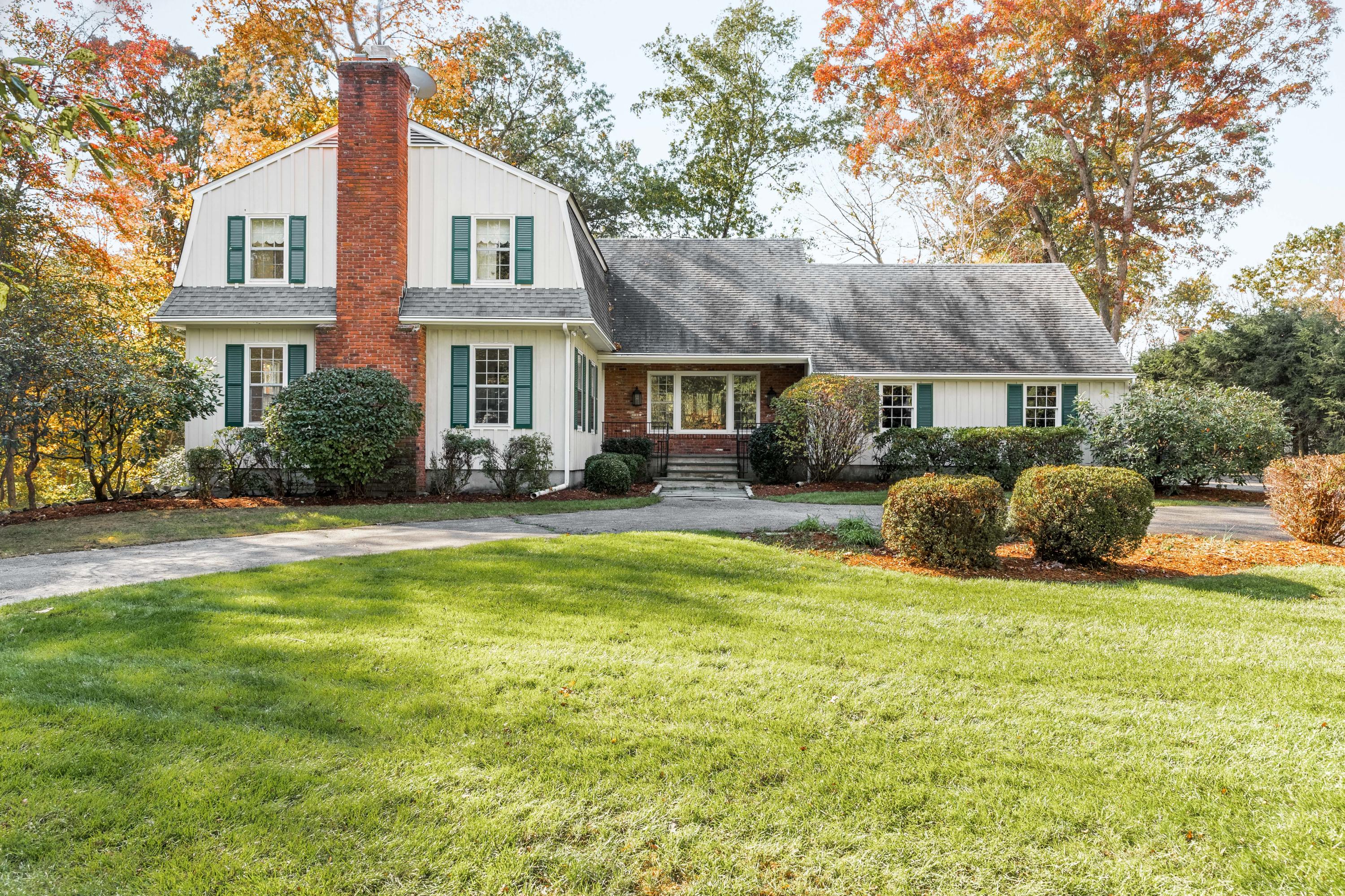 21 Barringer Road Darien, CT 06820 - Photo 1 of 34 a view of a house with a patio and a yard