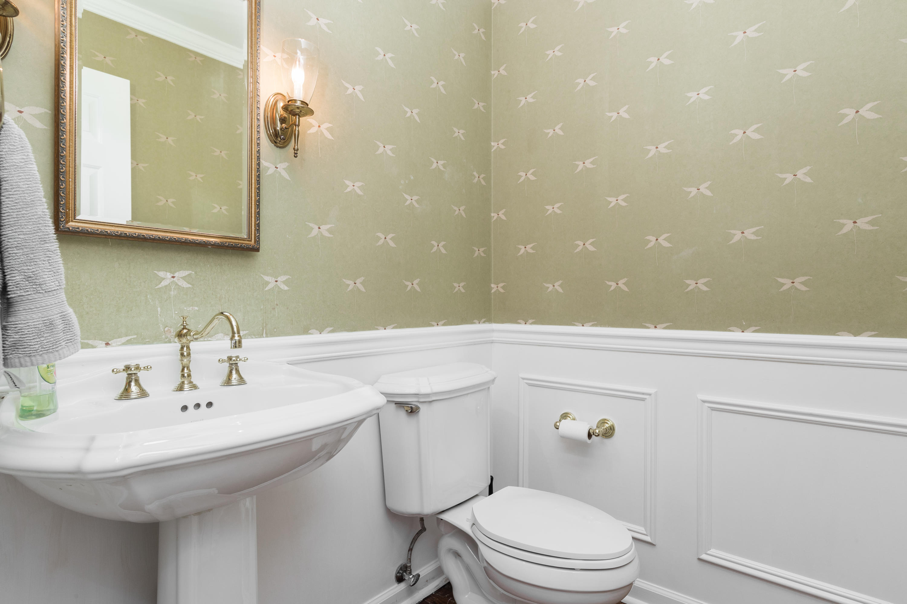 21 Barringer Road Darien, CT 06820 - Photo 13 of 34 a bathroom with a sink a toilet and mirror