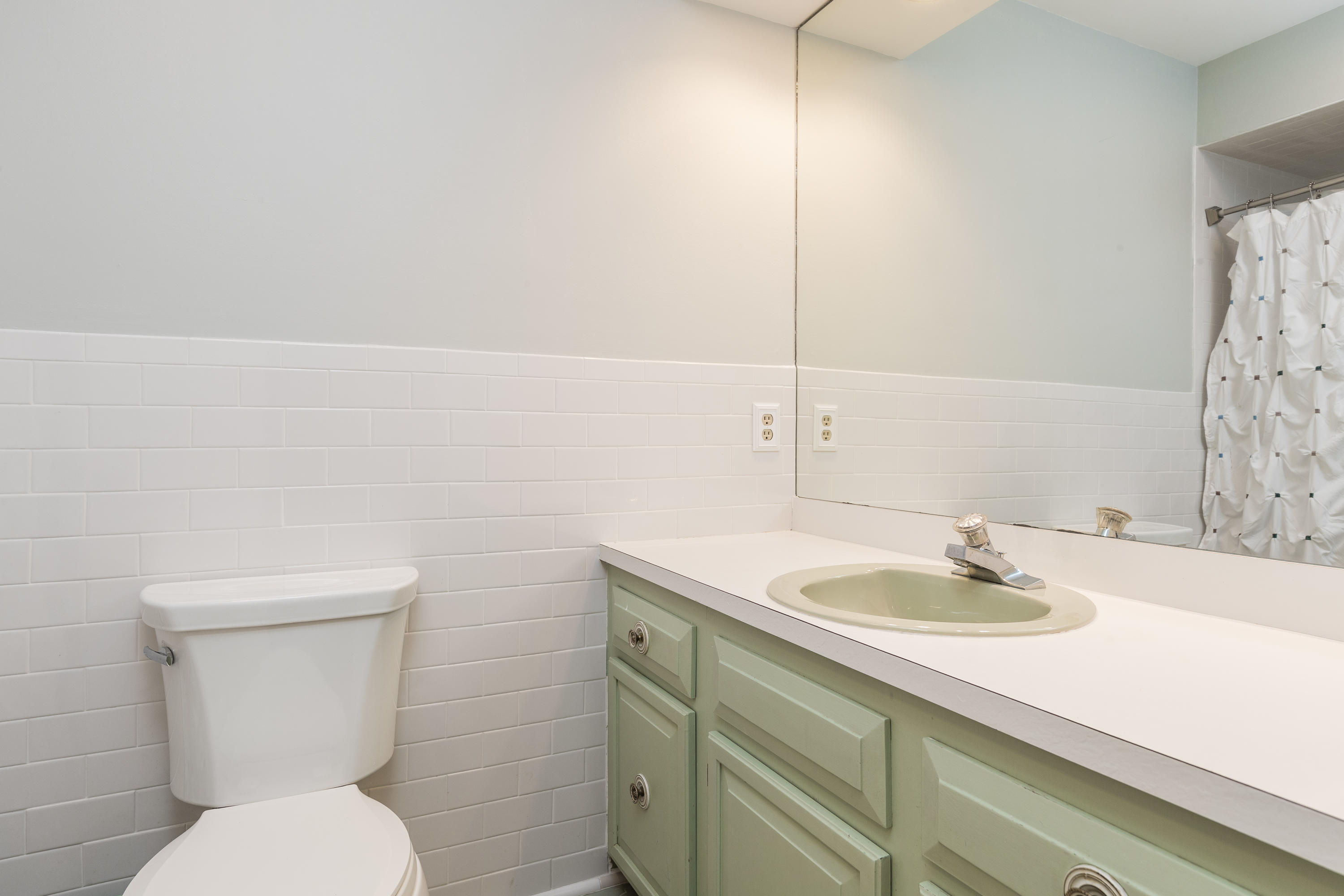 21 Barringer Road Darien, CT 06820 - Photo 20 of 34 a bathroom with a sink toilet and a mirror
