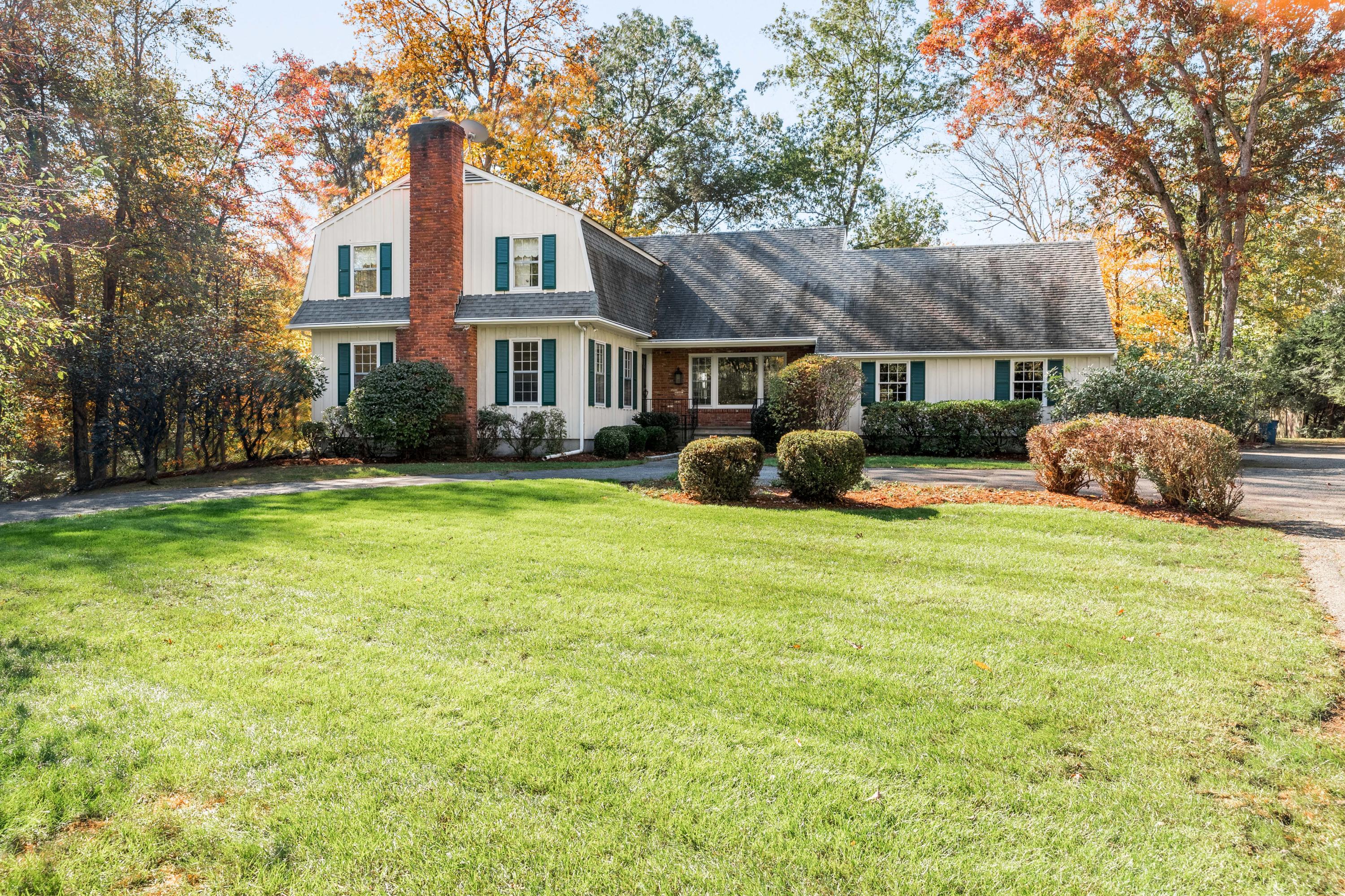 21 Barringer Road Darien, CT 06820 - Photo 2 of 34 a front view of a house with garden