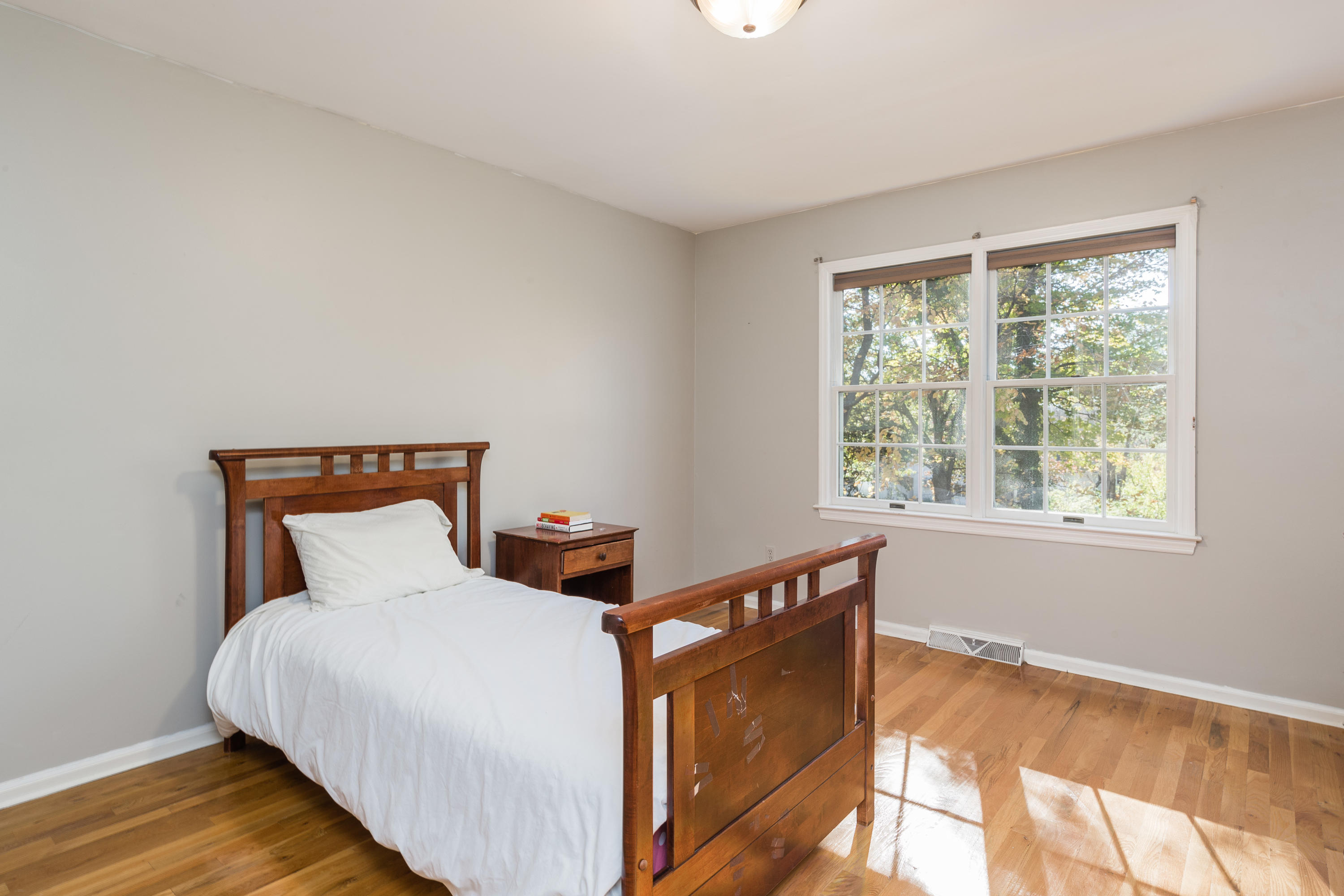 21 Barringer Road Darien, CT 06820 - Photo 21 of 34 a bedroom with bed and window
