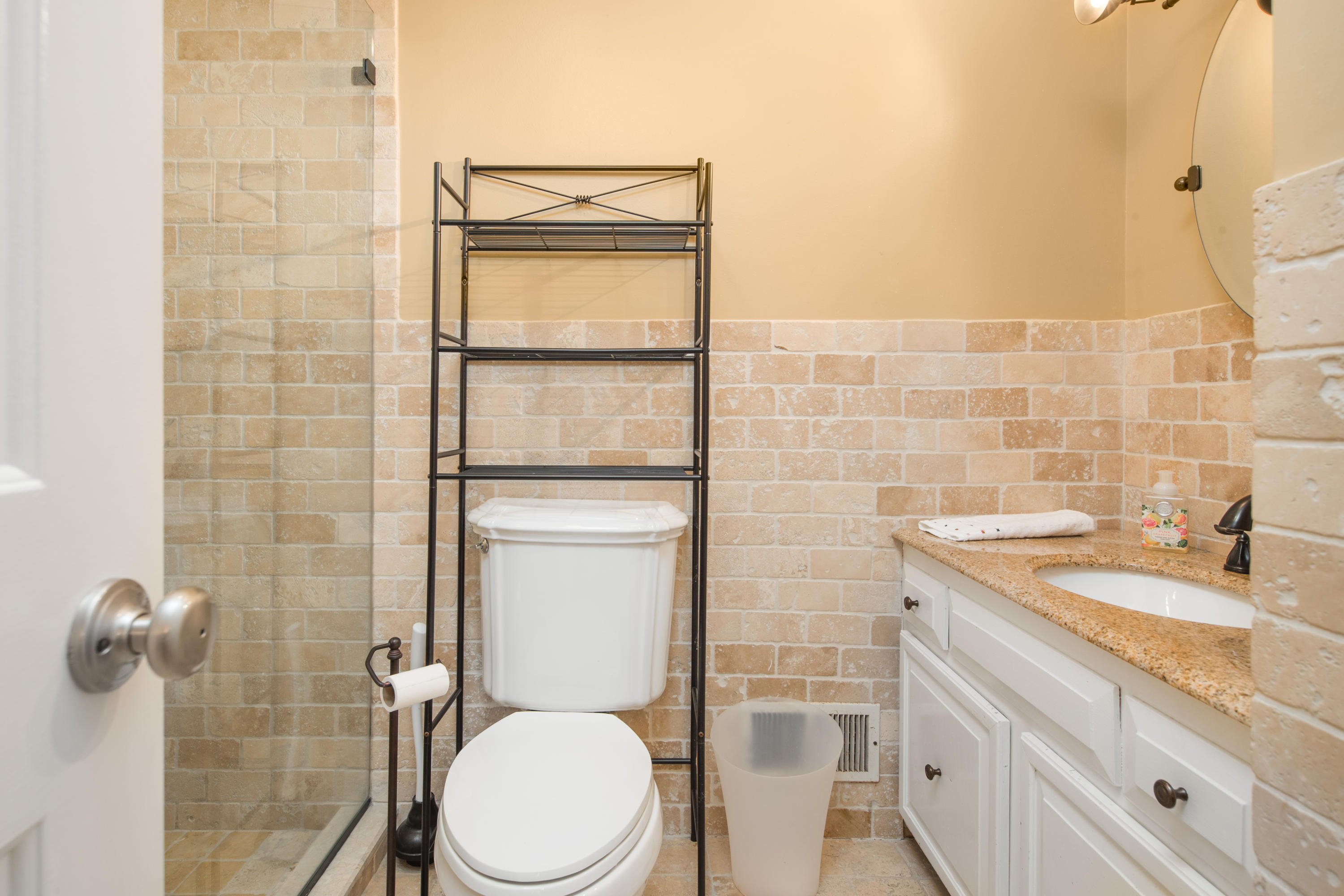 21 Barringer Road Darien, CT 06820 - Photo 26 of 34 a bathroom with a granite countertop toilet sink and mirror