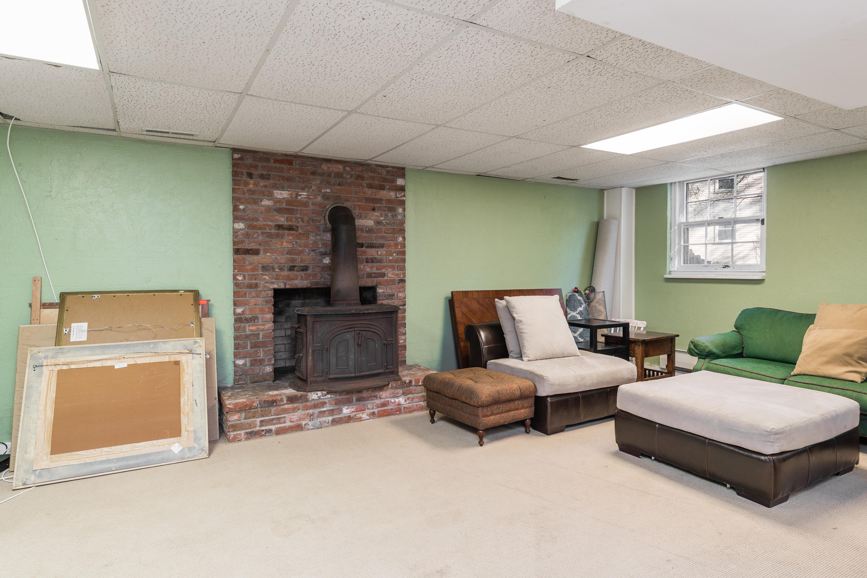 21 Barringer Road Darien, CT 06820 - Photo 28 of 34 a living room with furniture and a fireplace