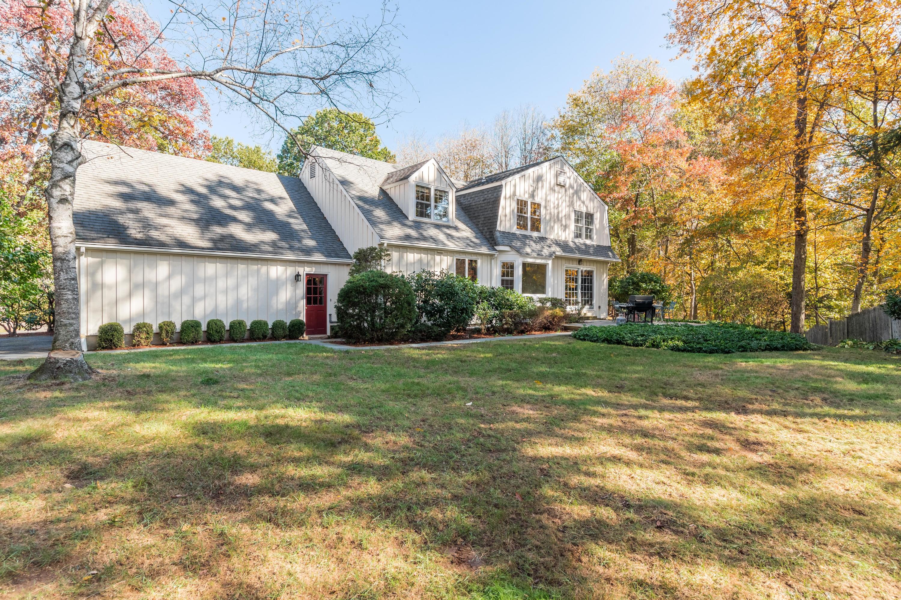 21 Barringer Road Darien, CT 06820 - Photo 31 of 34 a view of a house with a big yard and large trees