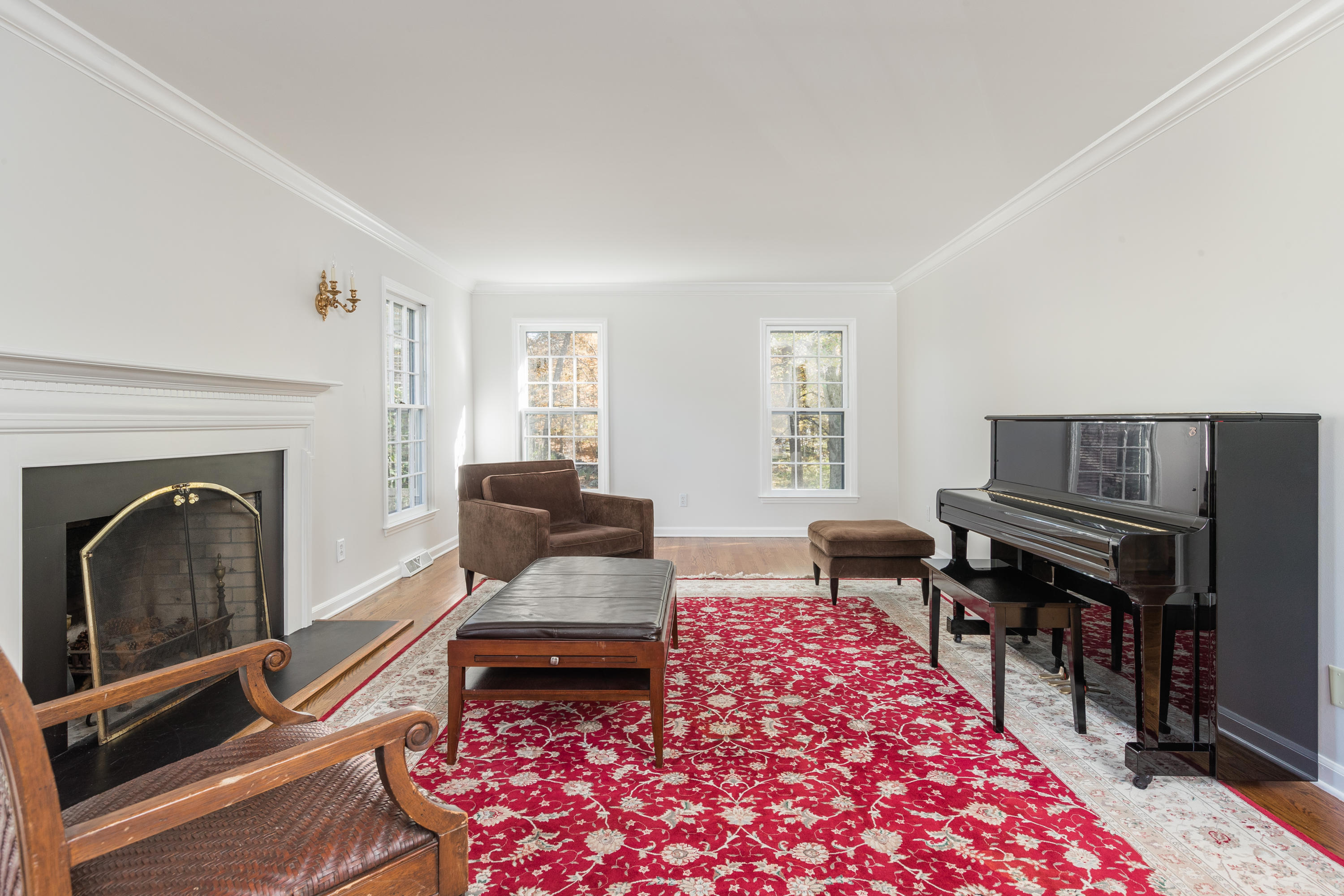 21 Barringer Road Darien, CT 06820 - Photo 6 of 34 a living room with furniture and a fireplace