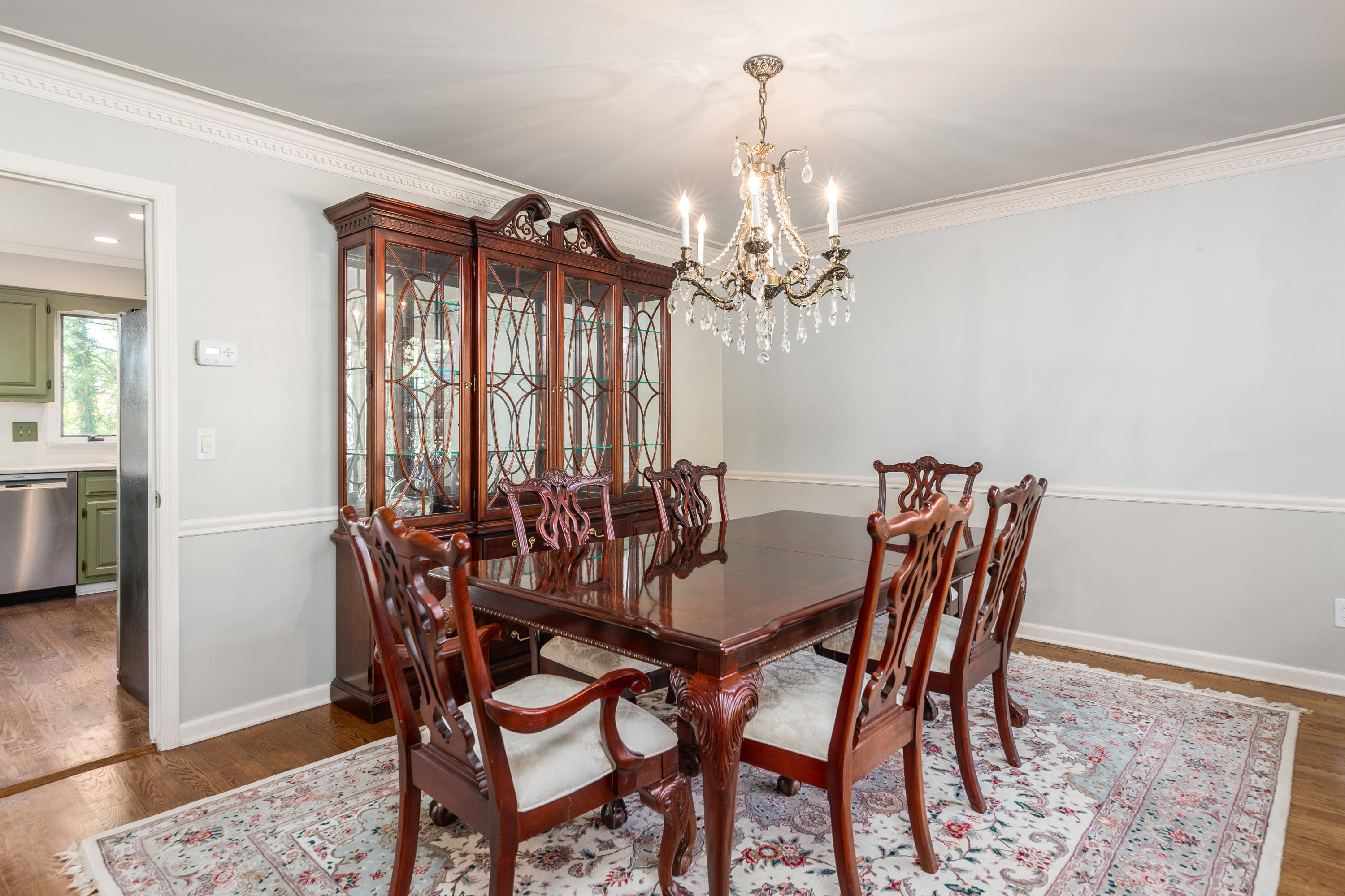 21 Barringer Road Darien, CT 06820 - Photo 8 of 34 a view of a dining room with furniture and chandelier