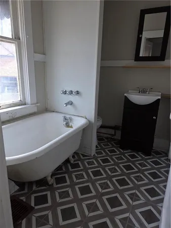 a bathroom with a bathtub and a sink