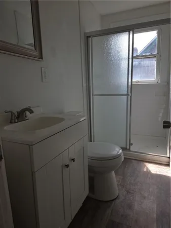 a bathroom with a toilet and a sink
