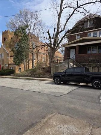 a car parked in front of a house
