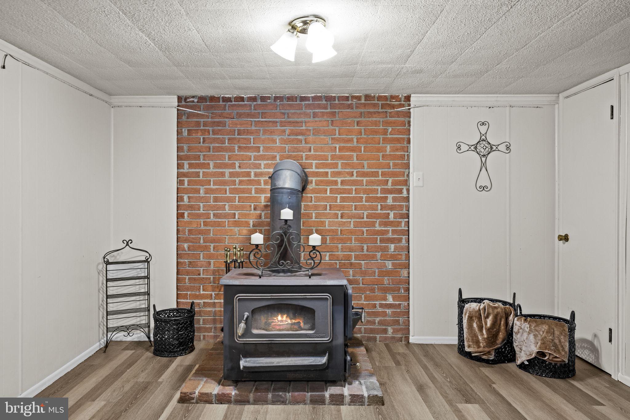171 Triple J Road Berryville, VA 22611 - Photo 56 of 95 Large wood stove for cozy winter gatherings!