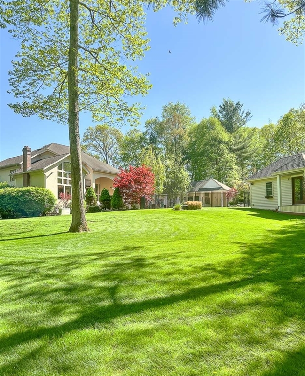 37 Putnam Hill Road Sutton, MA 01590 - Photo 2 of 42 a front view of a house with a yard table and chairs