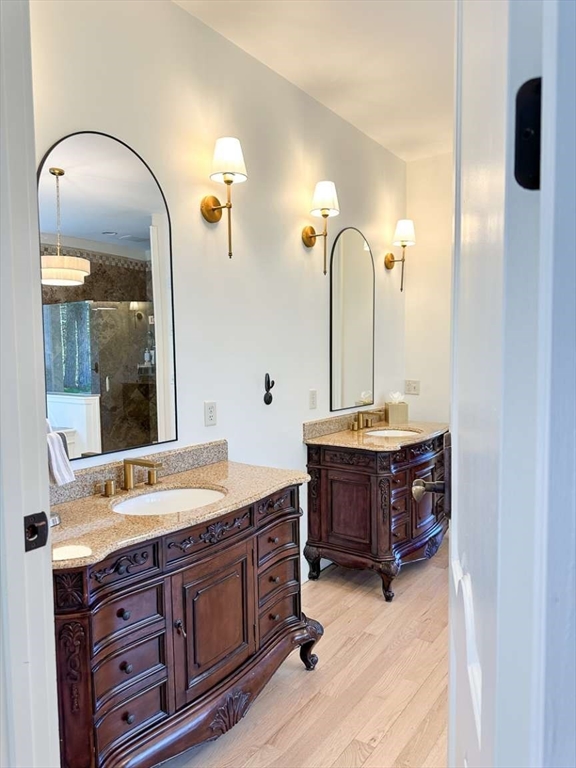 37 Putnam Hill Road Sutton, MA 01590 - Photo 24 of 42 a bathroom with a double vanity sink and a mirror
