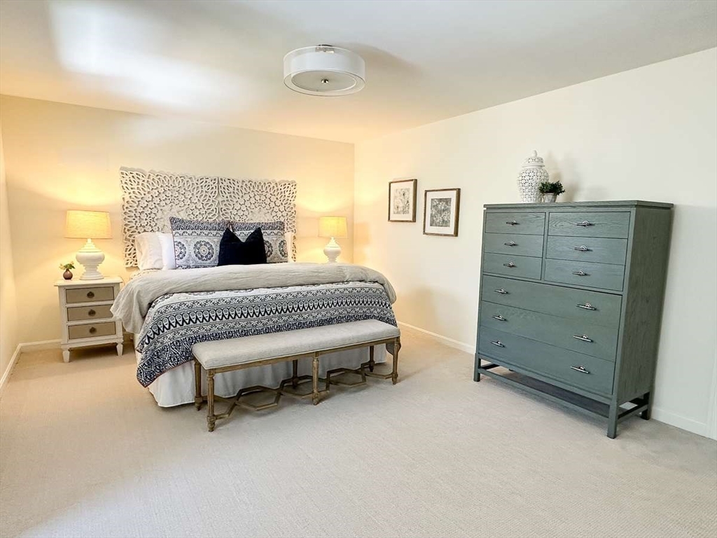 37 Putnam Hill Road Sutton, MA 01590 - Photo 25 of 42 a bedroom with a bed and a dresser