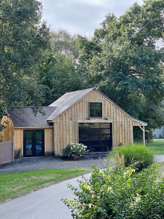 37 Putnam Hill Road Sutton, MA 01590 - Photo 3 of 42 a front view of a house with a garden