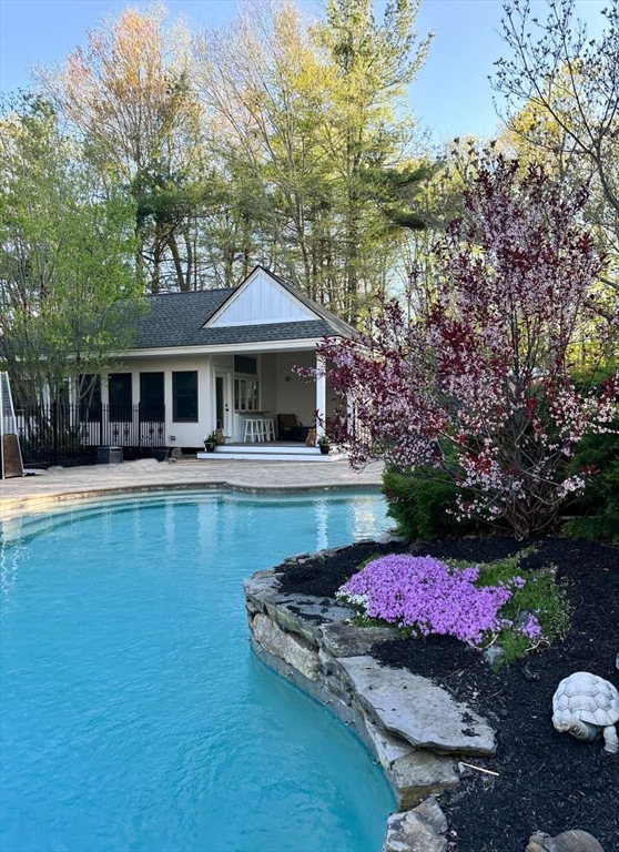 37 Putnam Hill Road Sutton, MA 01590 - Photo 38 of 42 a front view of a house with swimming pool garden and patio