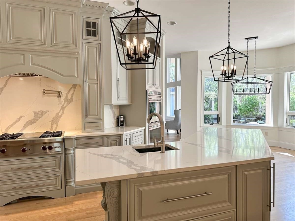 37 Putnam Hill Road Sutton, MA 01590 - Photo 8 of 42 a kitchen with a sink and chandelier