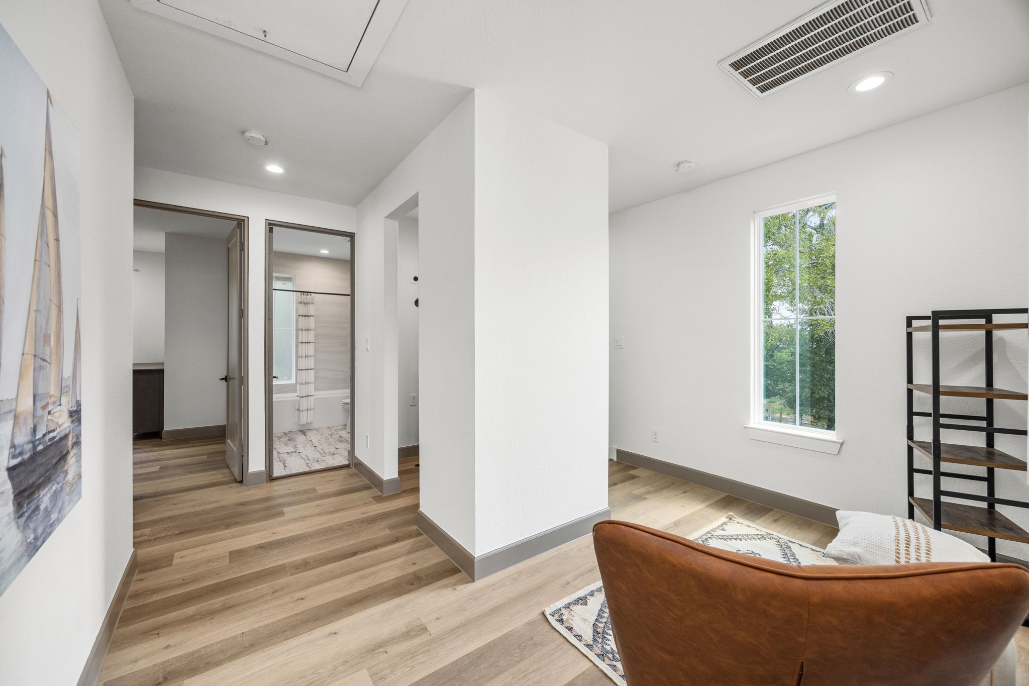 7934 Hennessy Lane, Unit 2 Spring, TX 77389 - Photo 23 of 36 a living room with furniture and a window