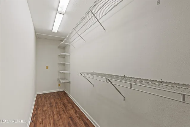 a view of a room with racks on the wall