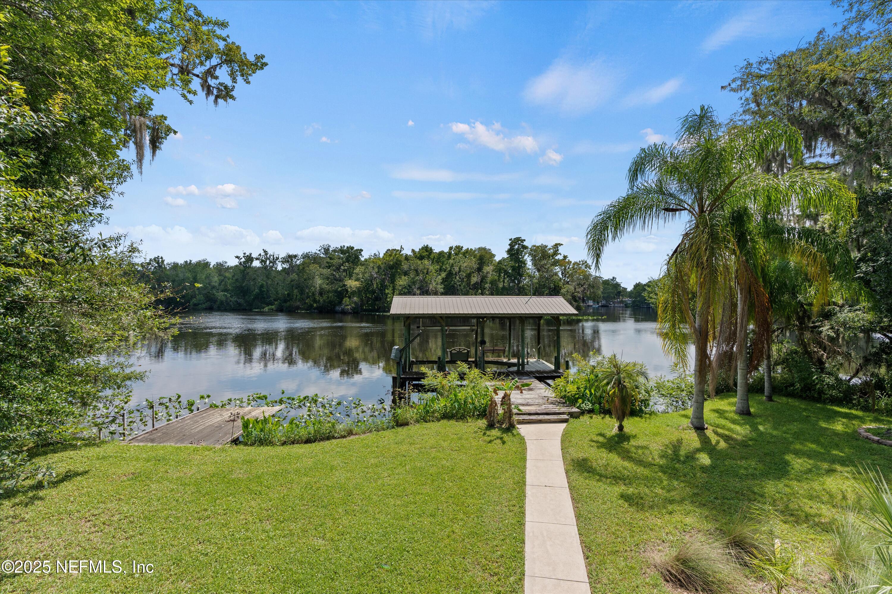 145 Finnigan Road Satsuma, FL 32189 - Photo 28 of 33 a view of a lake with a garden
