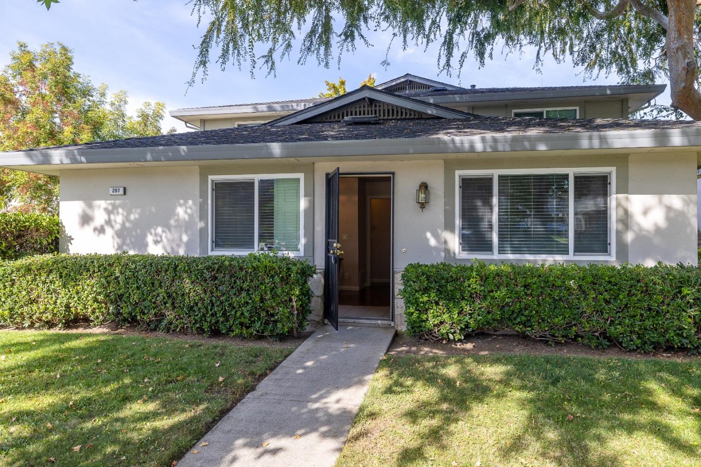 front view of a house with a garden